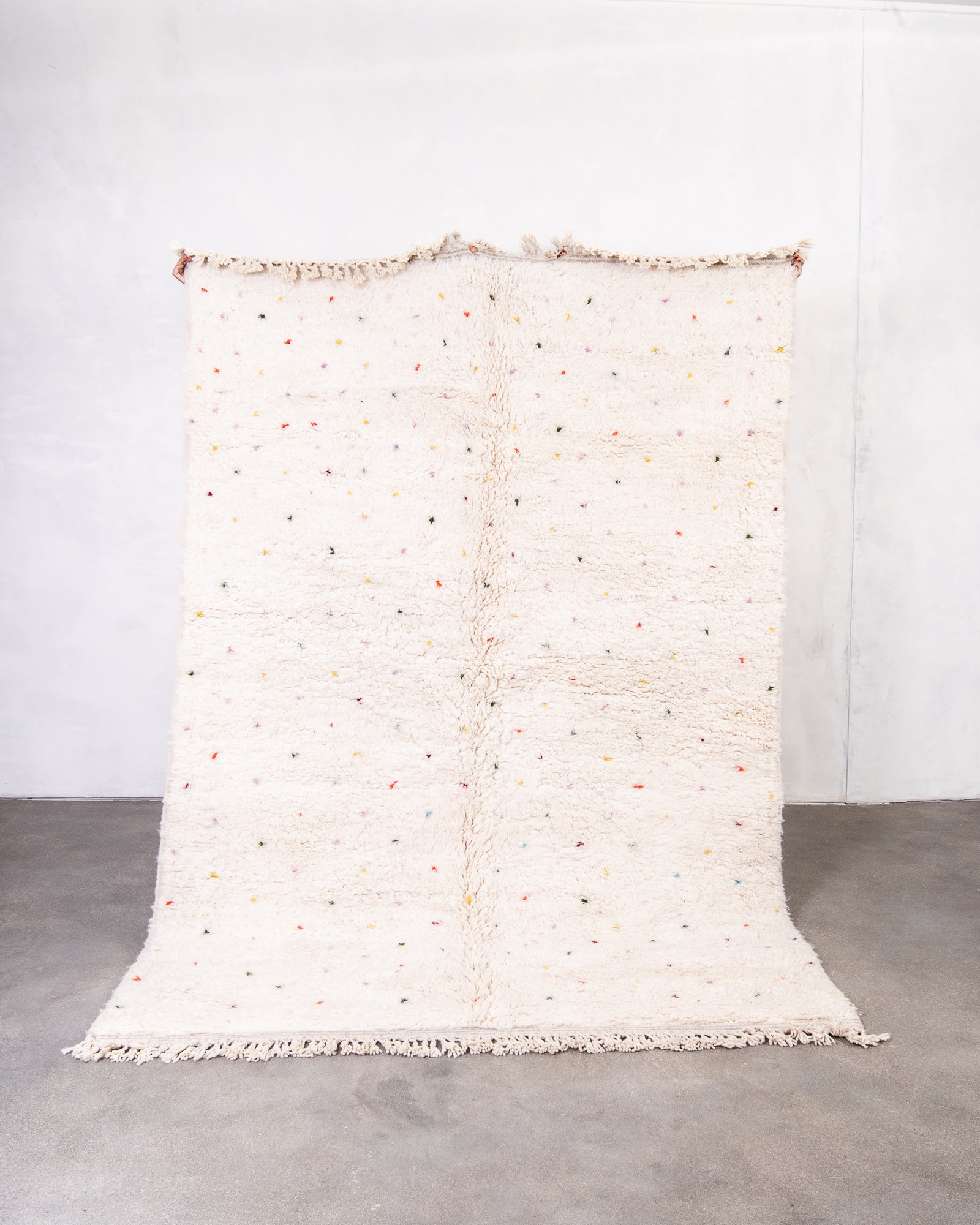 Modern, designer, handcrafted Berber rug from Morocco. Beniourain carpet with beautiful colours and patterns and fluffy wool texture.